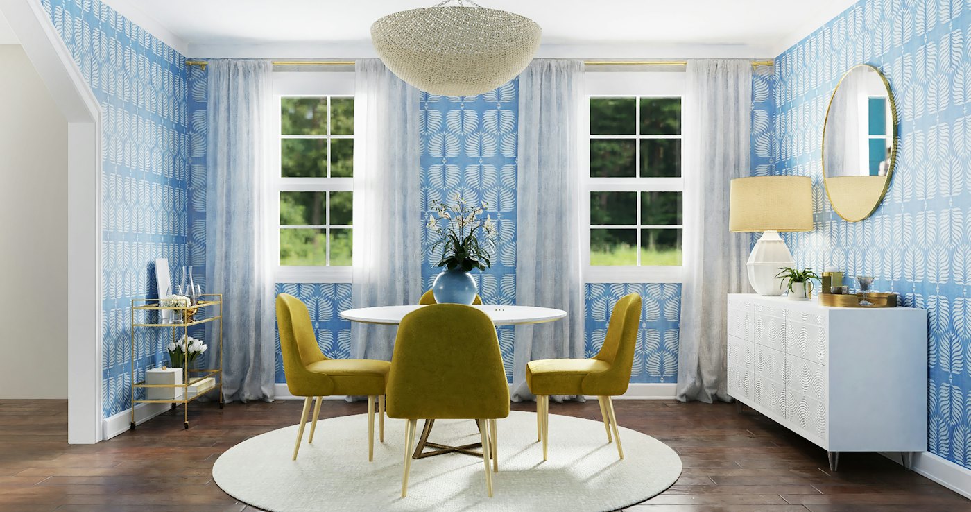 Breakfast nook with a round table against blue patterned wallpaper