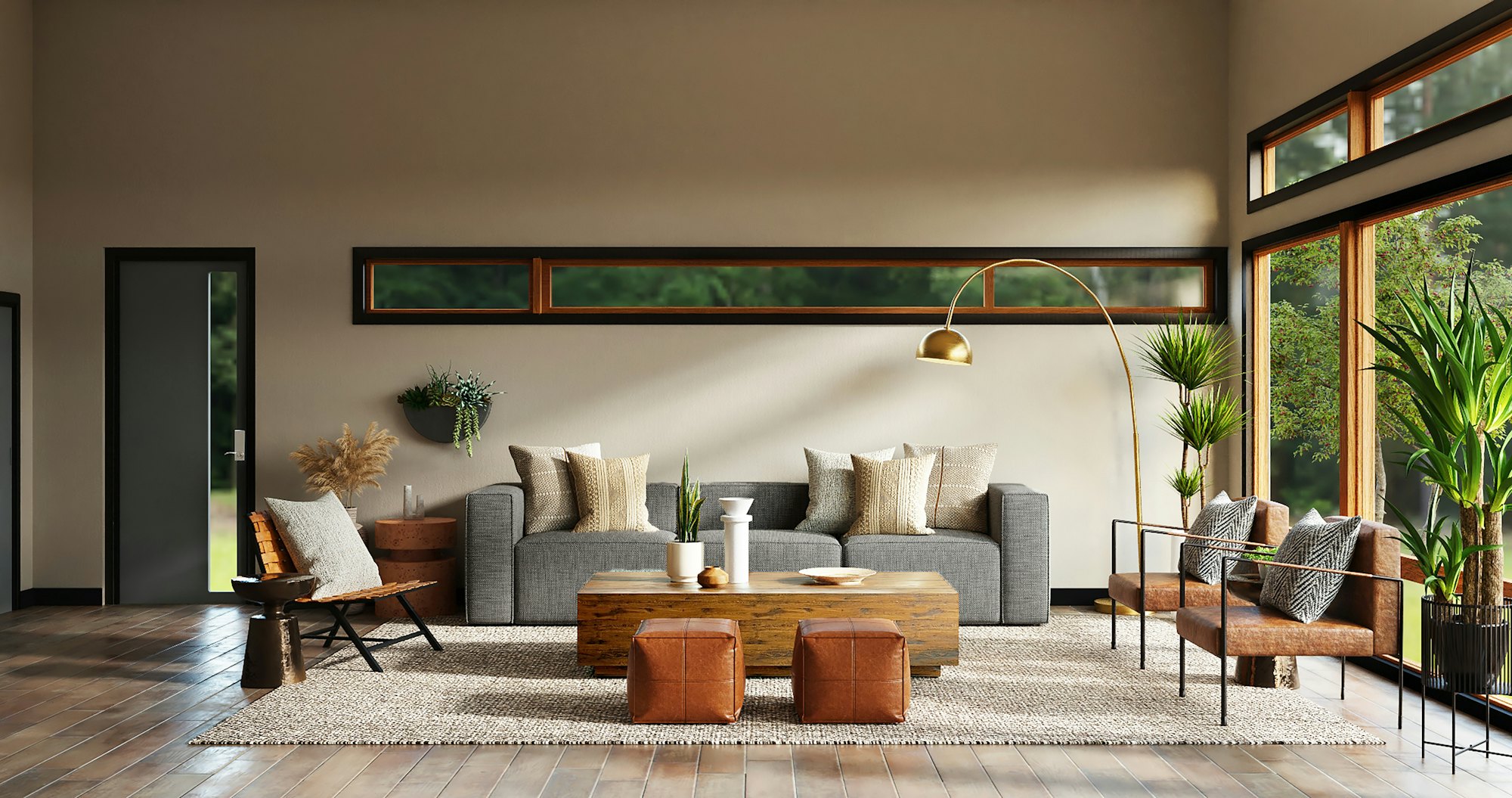 Low grey sofa, leather ottomans and an arc floor lamp beneath a clerestory window