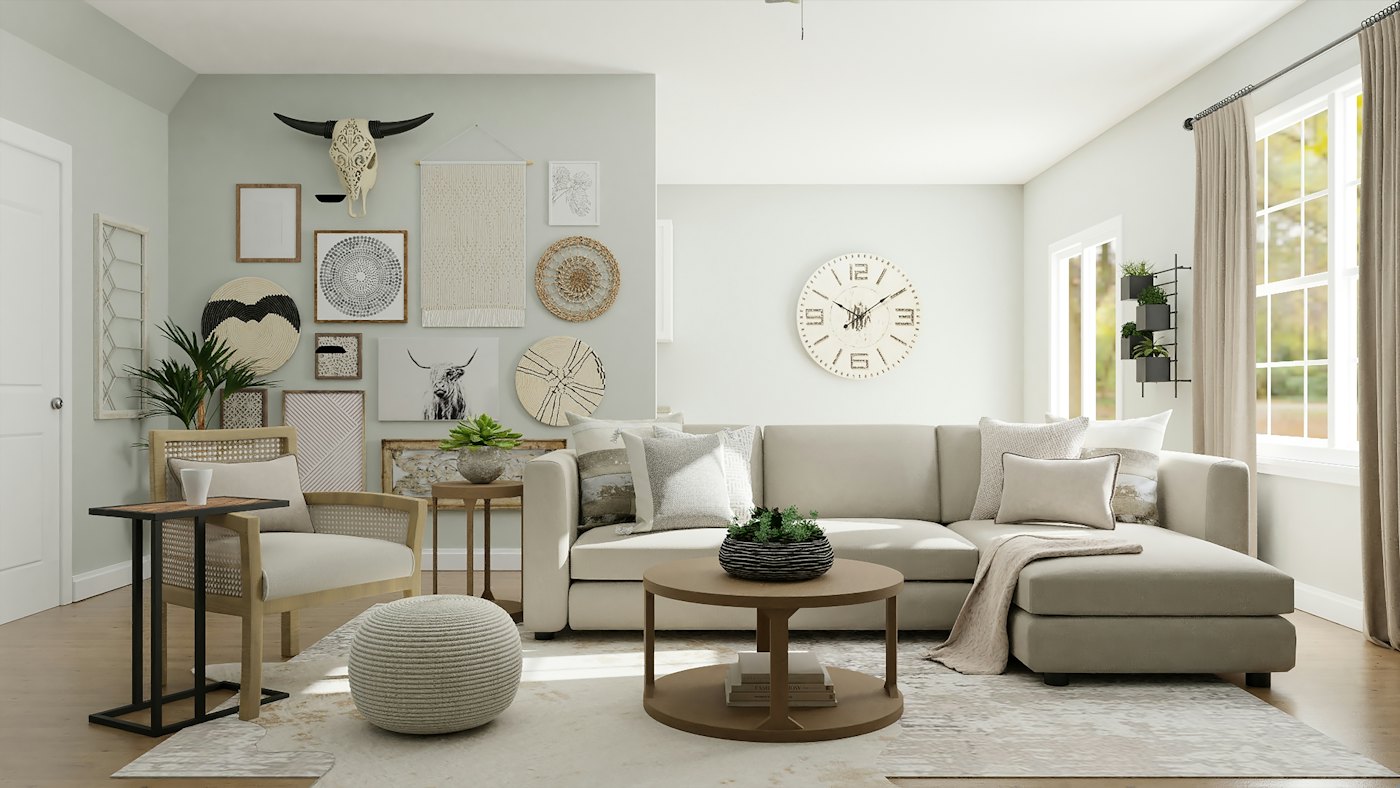 Neutral living room with a cream sectional, round coffee table and wall décor