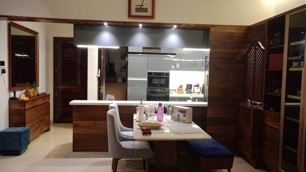Open kitchen and dining with grey PU-paint tall units