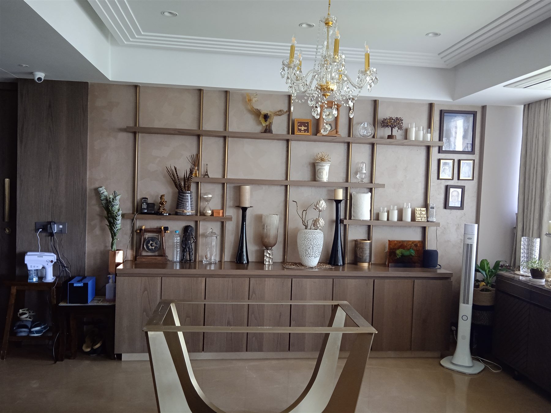 Built-in display shelving and chandelier