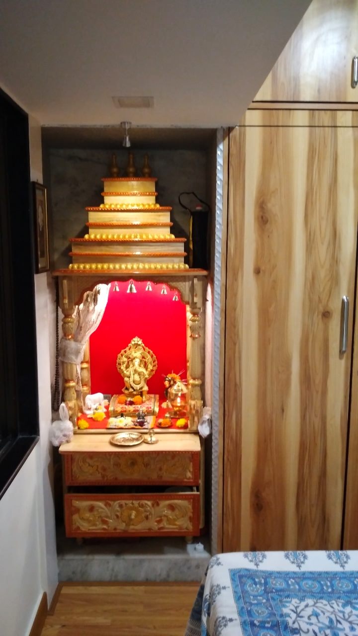 Lit mandir unit beside the wardrobe